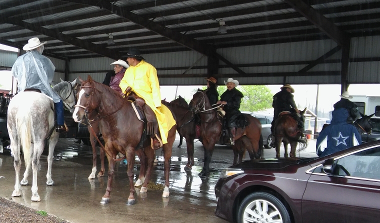 A cold wet group of riders gathered at the covered bandstand after the 2017 Zapata County Fair Trail Ride.